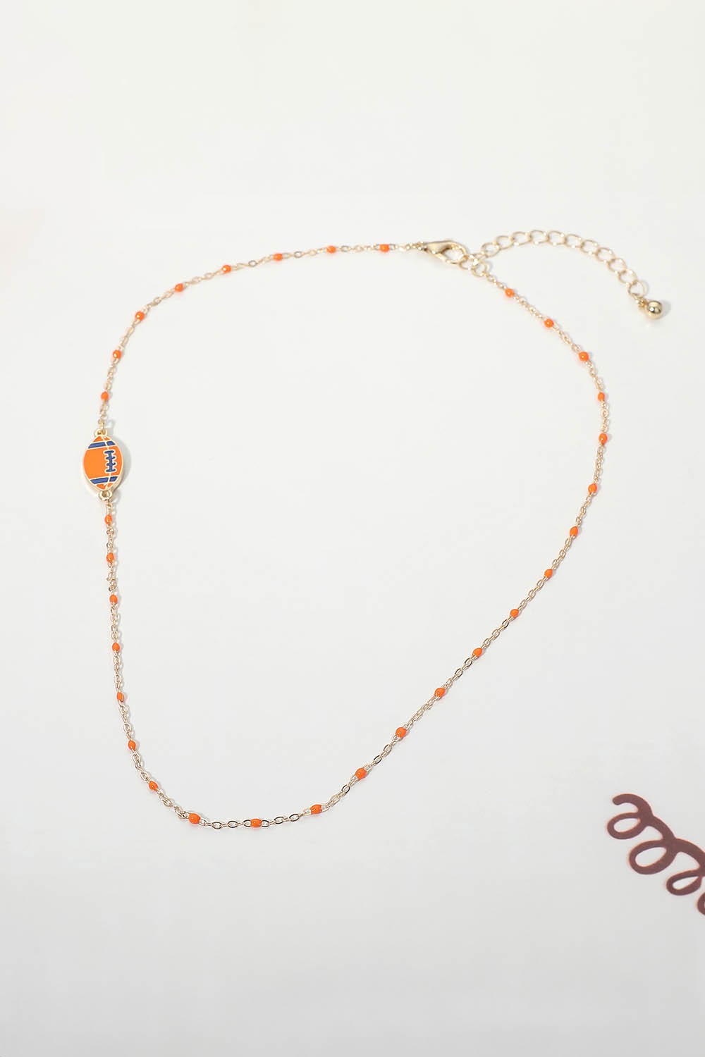 Dainty Seed Bead Sideways Football Necklace