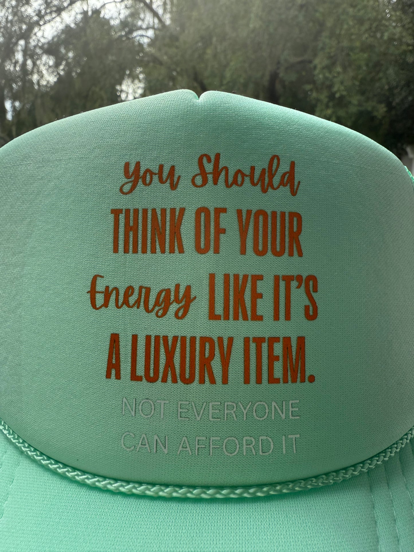 Energy is Luxury Trucker Hat