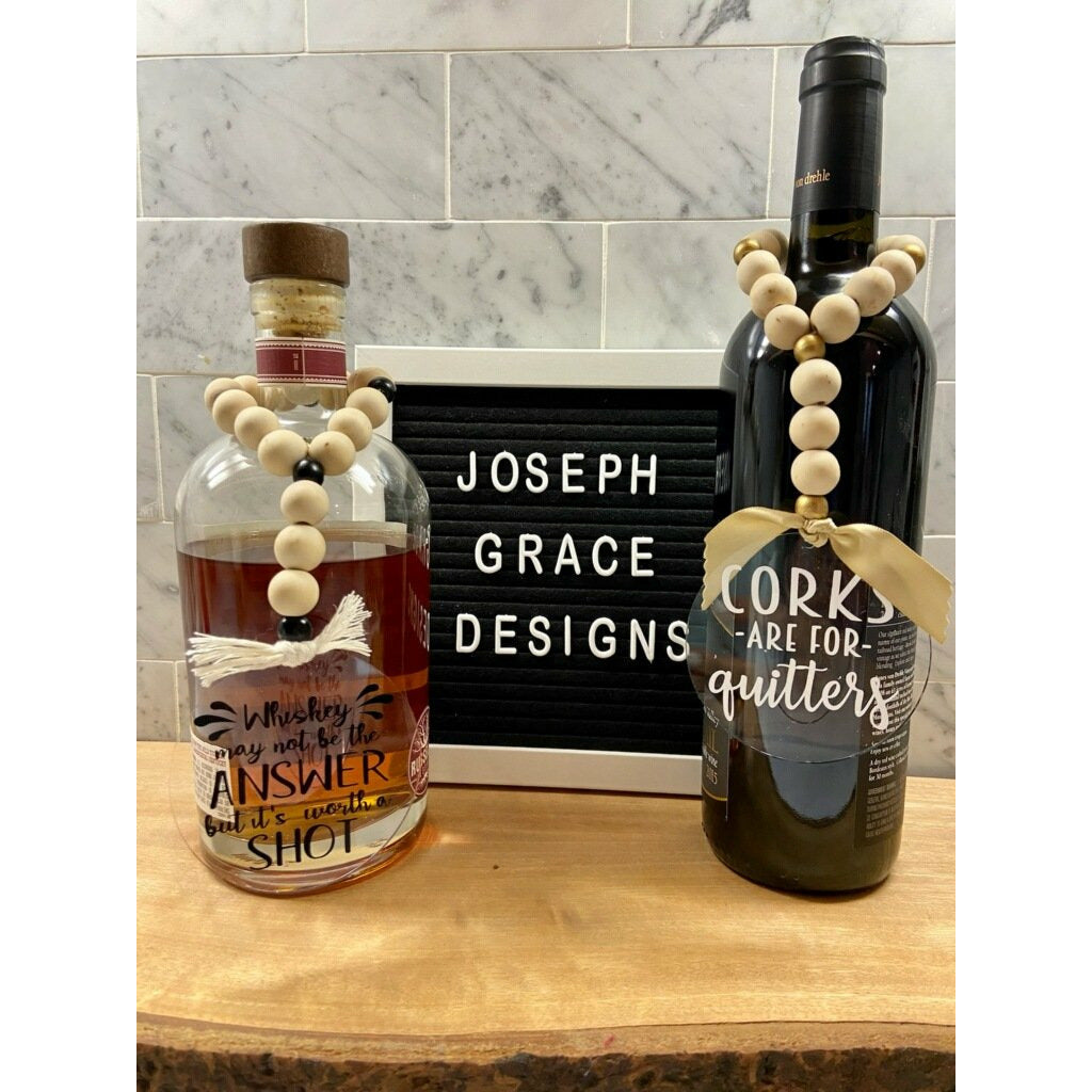 Bottle Necklaces by Joseph Grace