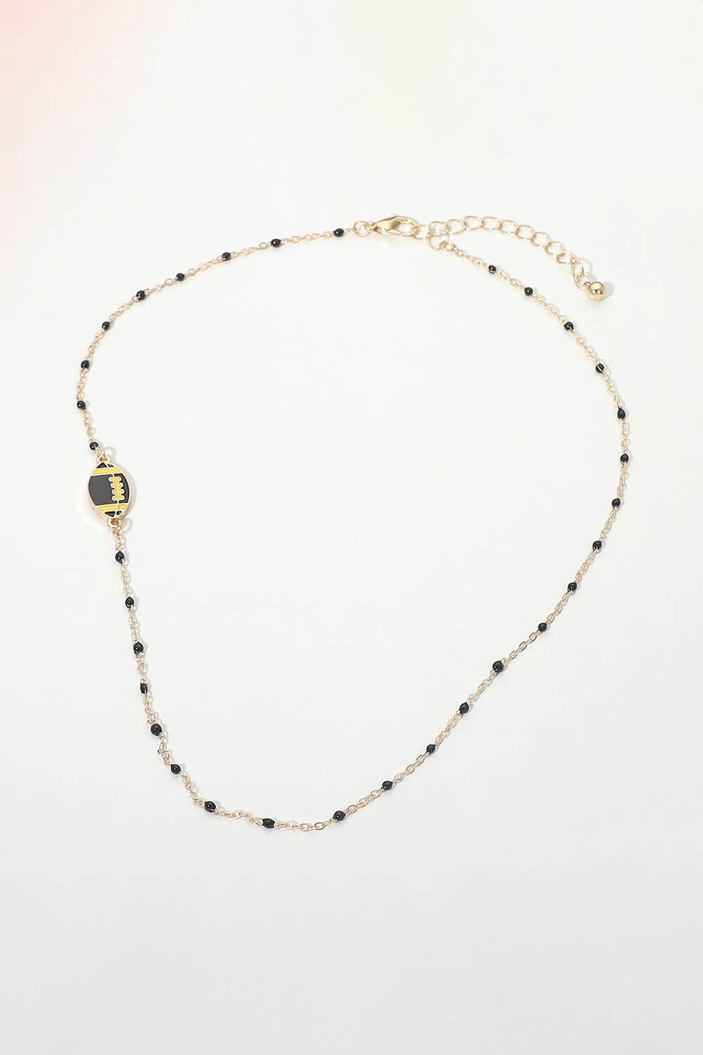 Dainty Seed Bead Sideways Football Necklace